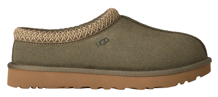 Green slip-on shoe with brown sole on a white background