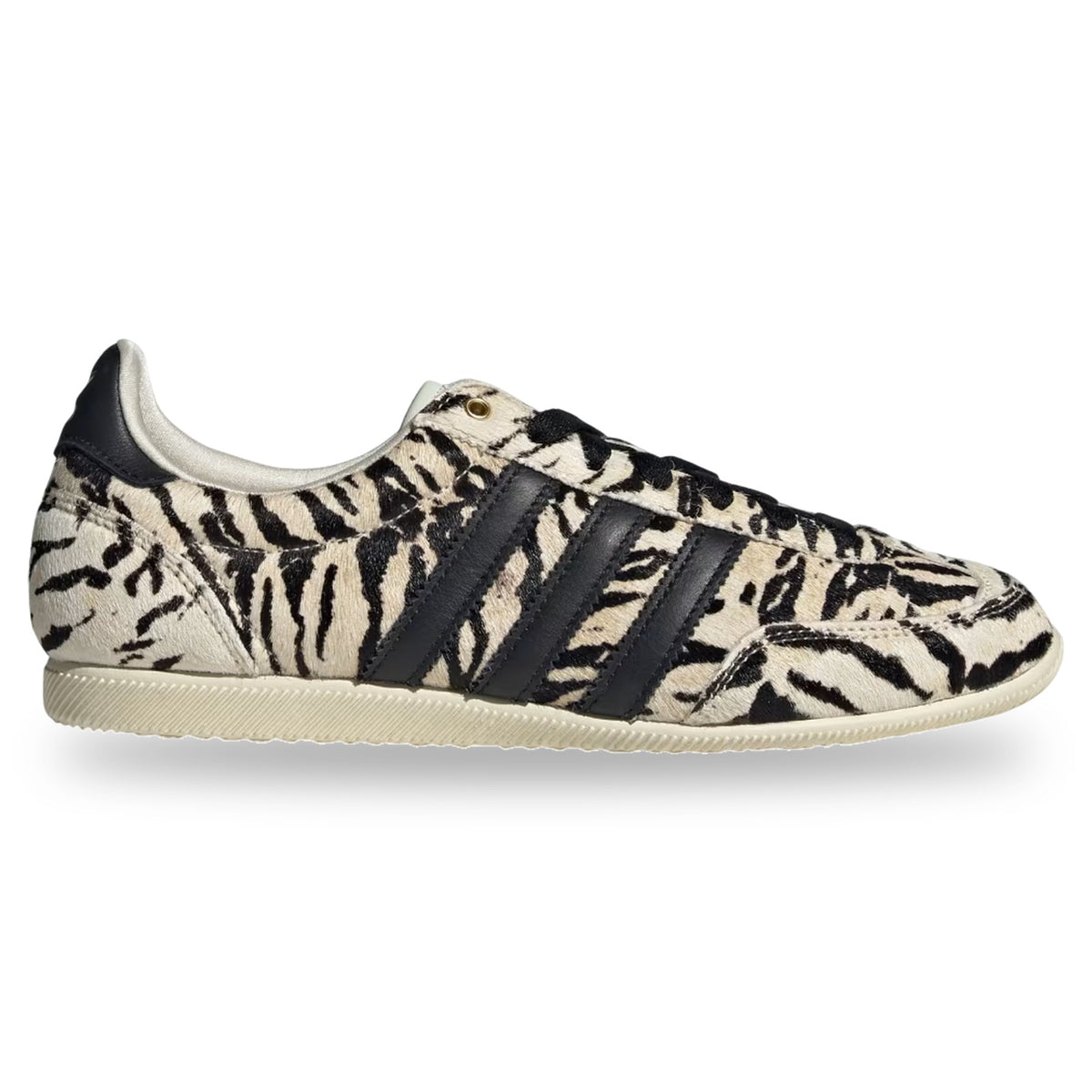 Zebra-patterned sneaker with black stripes on a white background