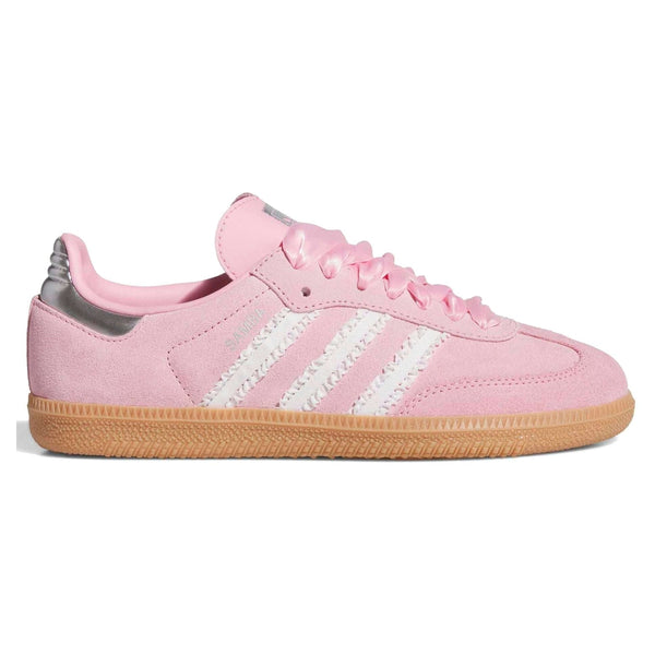 Pink Adidas sneaker with white stripes on a white background