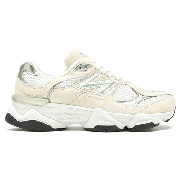White sneaker with black sole on a white background