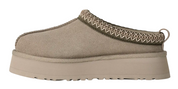 Beige slip-on shoe with platform sole on a white background