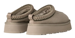 Pair of beige slippers with textured straps on a white background - Image 4