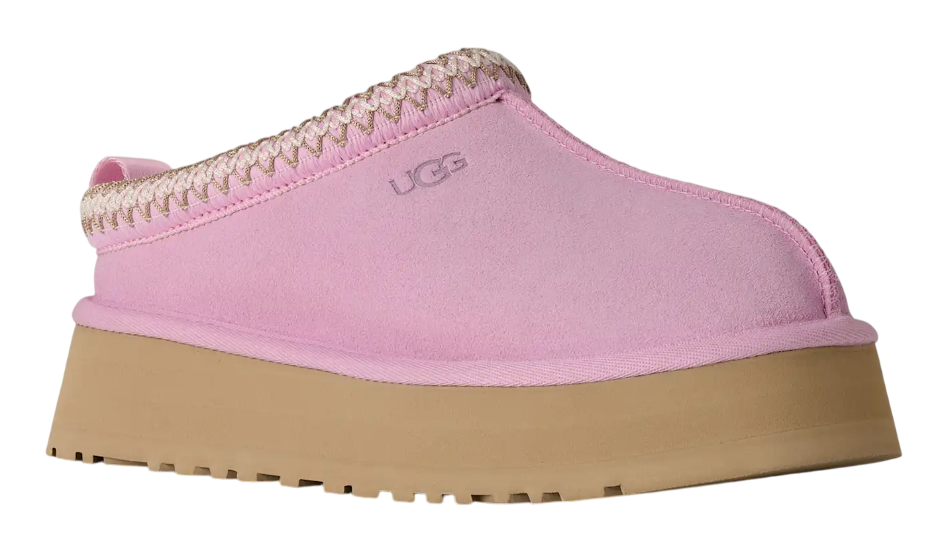 Pink UGG slip-on shoe with brown sole on a white background