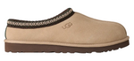 Beige UGG slipper with brown trim on a white background - Image 1