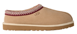 Tan UGG slipper with a white sole on a white background - Image 1