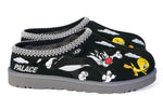 Black slippers with cartoon character design and 'Palace' branding on a white background - Image 1