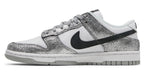 White sneaker with black swoosh logo and silver glittery side panel on a white background - Image 3
