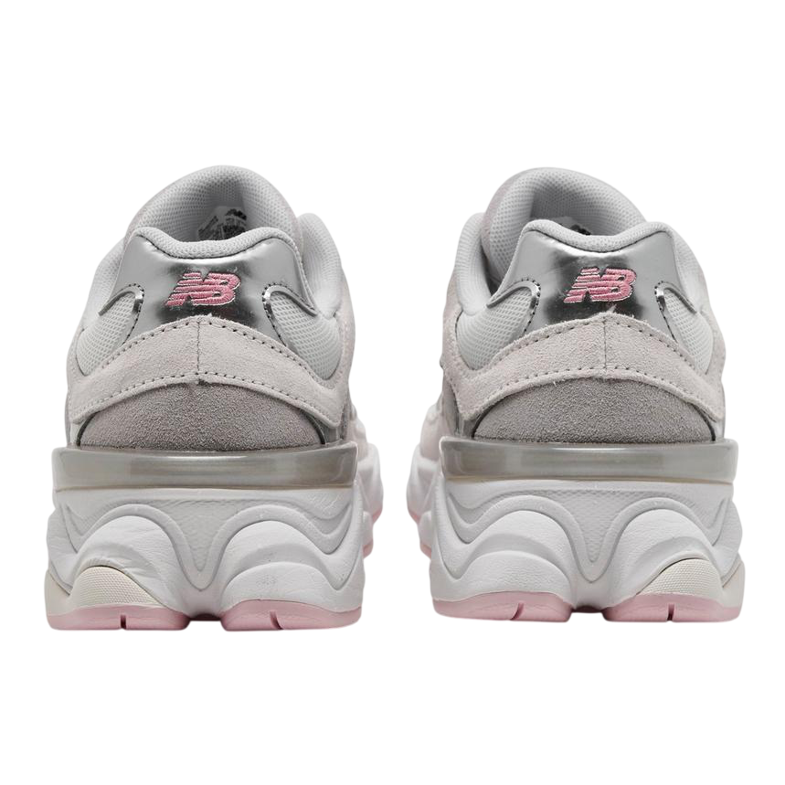 Pair of gray sneakers with pink accents on a white background