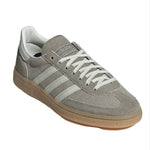 Gray Adidas sneaker with white stripes on a light gray background - Image 2