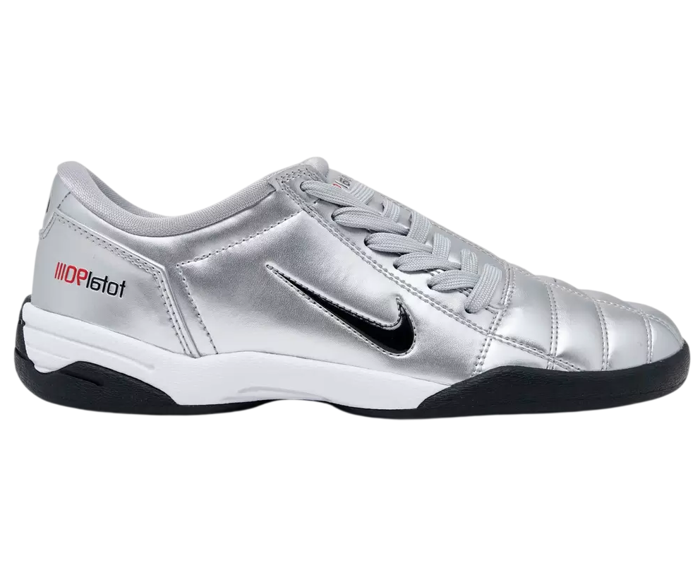 Silver sports shoe with black sole on a white background