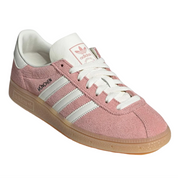 Pink Adidas sneaker with white laces and sole on a white background
