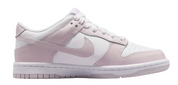 Pink and white sneaker with Nike logo on a white background
