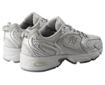 Pair of gray New Balance sneakers on a white background - Image 4