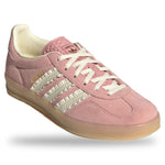 Pink Adidas sneaker with white laces on a light gray background - Image 2