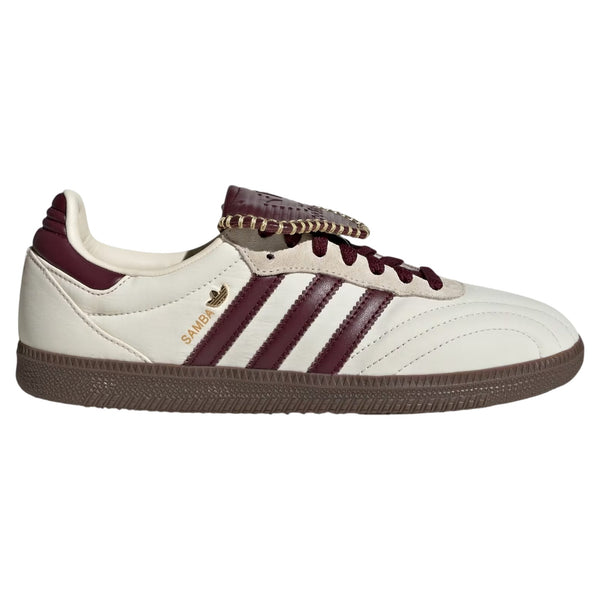 White and burgundy Adidas sneaker on a white background