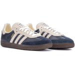 Pair of navy and white sneakers with three stripes on a white background - Image 2