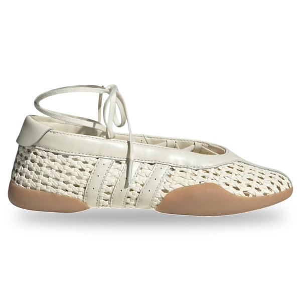 White woven shoe with tan insole on a white background