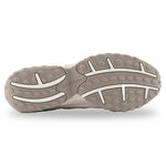 Close-up of a gray shoe sole with New Balance branding on a white background - Image 5