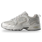 Gray athletic shoe with New Balance logo on a white background - Image 3