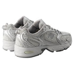 Pair of gray New Balance sneakers on a white background - Image 4