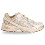 Beige sneaker with floral pattern on a white background - Image 1