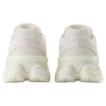 White sneakers with a transparent sole on a light gray background - Image 5