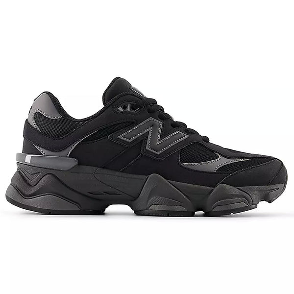 Black athletic shoe with red accents on a white background