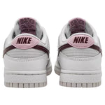 White Nike sneakers with pink swoosh logo on a white background - Image 3
