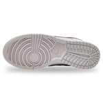 Close-up of a shoe sole with brand logo on a white background - Image 5