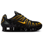Black and yellow sneaker on a white background - Image 1