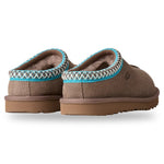 Pair of brown slippers with blue trim on a white background - Image 4