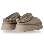 Pair of beige slippers with textured straps on a white background - Image 4
