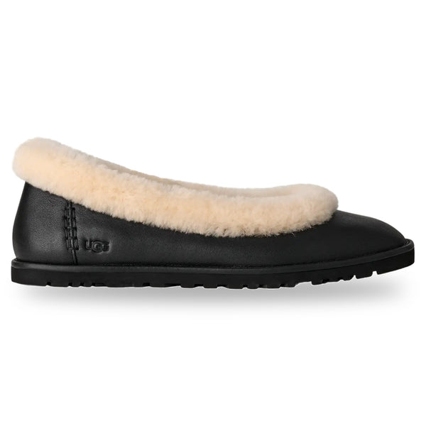 Black slipper with beige fur lining on a white background